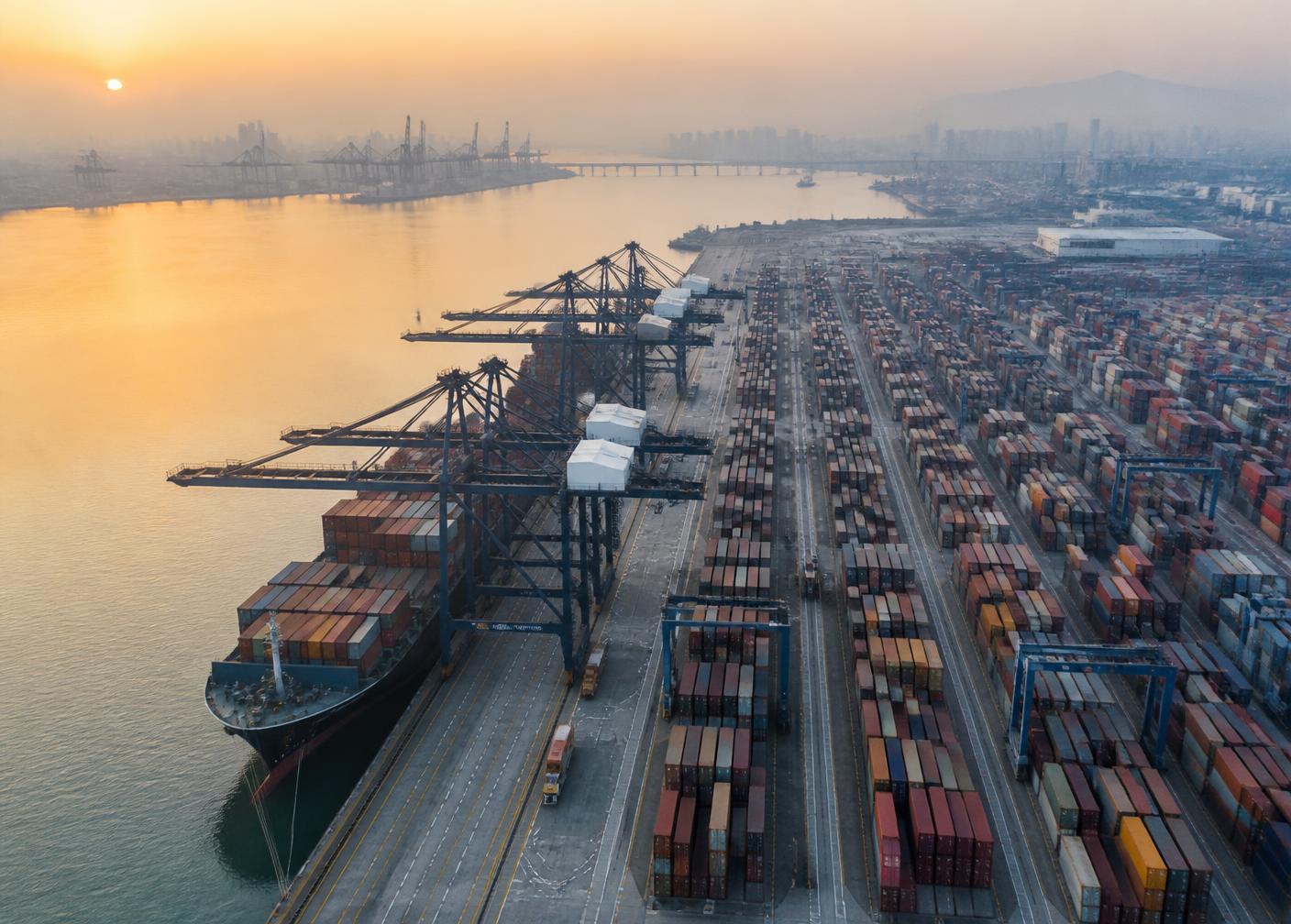 Aerial view of a container shipping port at dawn